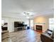 Living area with fireplace, large TV, and comfortable seating at 32122 Hickory Ln, Sorrento, FL 32776