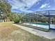 Screened pool with surrounding yard at 32122 Hickory Ln, Sorrento, FL 32776