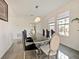 Bright dining room with a glass table and modern chairs at 352 Radisson Pl, Oviedo, FL 32765