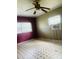 Bedroom with tile floors and ceiling fan at 4910 Huppel Ave, Orlando, FL 32811