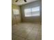 Bedroom with tile floors and window coverings at 4910 Huppel Ave, Orlando, FL 32811
