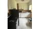 Kitchen with white cabinets and appliances at 4910 Huppel Ave, Orlando, FL 32811