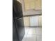 Kitchen with black appliances and white cabinets at 4910 Huppel Ave, Orlando, FL 32811
