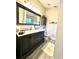 Elegant bathroom with a double sink vanity, a large mirror, and a tiled shower at 144 Rose Hill Trl, Sanford, FL 32773