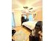Bedroom with wood-look floors, ceiling fan, and closet at 144 Rose Hill Trl, Sanford, FL 32773