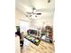 Bedroom features wood-look floors, ceiling fan, and a lofted bed at 144 Rose Hill Trl, Sanford, FL 32773