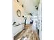 Inviting entryway with wood flooring, high ceilings, and modern decor at 144 Rose Hill Trl, Sanford, FL 32773