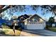 Charming single-story home with mature trees and a well-maintained lawn at 144 Rose Hill Trl, Sanford, FL 32773