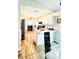 Kitchen area featuring white cabinets and breakfast bar at 144 Rose Hill Trl, Sanford, FL 32773