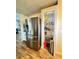 Gourmet kitchen with stainless steel refrigerator and pantry at 144 Rose Hill Trl, Sanford, FL 32773