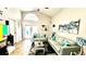Bright living room features vaulted ceilings, modern furnishings, and art at 144 Rose Hill Trl, Sanford, FL 32773