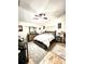 Spacious main bedroom with vaulted ceiling, ceiling fan, wood flooring, and stylish furniture at 144 Rose Hill Trl, Sanford, FL 32773