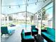 Relaxing screened-in patio with comfortable seating and string lights overlooking the refreshing pool at 144 Rose Hill Trl, Sanford, FL 32773