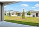 A lovely backyard and patio offers a green space for relaxation and entertainment at 192 Flag Lilly Ln, Umatilla, FL 32784