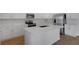 Modern kitchen featuring white cabinets, stainless steel appliances, and center island at 192 Flag Lilly Ln, Umatilla, FL 32784