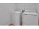 An appliance filled laundry room with a washer and dryer in a bright space at 192 Flag Lilly Ln, Umatilla, FL 32784