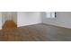 Bright living room with sleek wood-look tile floors and neutral walls at 192 Flag Lilly Ln, Umatilla, FL 32784