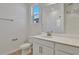 Bright bathroom featuring a sleek vanity with modern fixtures and a tiled shower, perfect for a modern home at 207 Bull Frog Ln, Umatilla, FL 32784