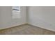 Cozy bedroom featuring carpet, a window, and neutral wall paint at 207 Bull Frog Ln, Umatilla, FL 32784