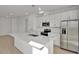 Stylish kitchen with stainless steel appliances, an island and a breakfast bar at 207 Bull Frog Ln, Umatilla, FL 32784