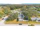 This aerial view showcases a home with solar panels in a well-maintained neighborhood surrounded by lush trees at 3000 Cashmere Dr, Orlando, FL 32827