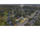 A bird's eye view of the property in a neighborhood filled with mature trees at 3000 Cashmere Dr, Orlando, FL 32827
