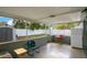 This enclosed patio features screened windows, gray brick, and ample room for entertainment and storage at 3000 Cashmere Dr, Orlando, FL 32827