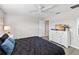 Relaxing bedroom featuring light grey walls, ceiling fan and large dresser at 4891 Clock Tower Dr, Kissimmee, FL 34746