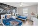 Comfortable bedroom featuring two beds, light walls, and wood-look flooring at 4891 Clock Tower Dr, Kissimmee, FL 34746