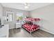 Cozy bedroom with bunk beds, light walls, and natural light at 4891 Clock Tower Dr, Kissimmee, FL 34746
