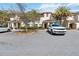 Lovely condo building with well-manicured greenery and ample parking space in a desirable neighborhood at 4891 Clock Tower Dr, Kissimmee, FL 34746