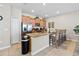 Spacious kitchen featuring granite countertops and breakfast bar seating at 4891 Clock Tower Dr, Kissimmee, FL 34746