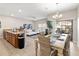 Open-concept living space blending the kitchen, dining, and living areas for seamless entertainment at 4891 Clock Tower Dr, Kissimmee, FL 34746