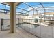 Screened pool with a spa, privacy fence, and lounge chairs at 4891 Clock Tower Dr, Kissimmee, FL 34746