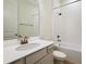 Clean bathroom with a white vanity, a large mirror, and a shower-tub combination at 195 Bull Frog Ln, Umatilla, FL 32784