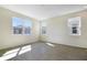 Bright bedroom with three windows offering ample natural light and wood-look flooring at 195 Bull Frog Ln, Umatilla, FL 32784
