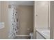 Standard bathroom featuring a shower with curtain, toilet, and vanity, providing essential features at 2078 Cypress Bay Blvd, Kissimmee, FL 34743
