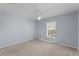 Bright bedroom with natural light and a ceiling fan, offering a comfortable space at 2078 Cypress Bay Blvd, Kissimmee, FL 34743