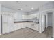 A spacious kitchen area with white cabinets and appliances, providing a clean cooking space at 2078 Cypress Bay Blvd, Kissimmee, FL 34743