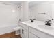 Bathroom featuring double vanity sinks, quartz countertops, and a bathtub shower at 1496 August Gray Dr, Kissimmee, FL 34744