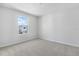 Bedroom with neutral carpet, neutral paint and a window with great natural light at 1496 August Gray Dr, Kissimmee, FL 34744