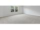 Cozy bedroom featuring neutral carpet, natural light and neutral paint at 1496 August Gray Dr, Kissimmee, FL 34744