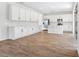 Spacious kitchen with white cabinetry, stainless steel appliances, and a large center island at 1496 August Gray Dr, Kissimmee, FL 34744