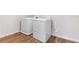 Laundry room featuring a washer and dryer with wood-look flooring at 1496 August Gray Dr, Kissimmee, FL 34744