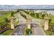 Scenic view of ChampionsGate entrance featuring manicured landscaping and welcoming signage beneath a cloudy blue sky at 1676 Moon Valley Dr, Davenport, FL 33896