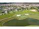 Scenic view of a well-maintained golf course within the community with a pond at 1676 Moon Valley Dr, Davenport, FL 33896