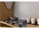 A compact kitchenette features modern decor and organized dishware on a black countertop at 5245 W Irlo Bronson Memorial Hwy # 160, Kissimmee, FL 34746
