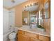 Well-lit bathroom with tub, vanity, and ample countertop space; a clean and functional design at 121 Madiera Beach Blvd, Kissimmee, FL 34746