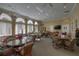 Spacious clubhouse with comfortable seating, ceiling fans, and entertainment options at 121 Madiera Beach Blvd, Kissimmee, FL 34746