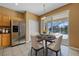 Cozy dining area with sliding glass doors offering serene water views and easy patio access at 121 Madiera Beach Blvd, Kissimmee, FL 34746